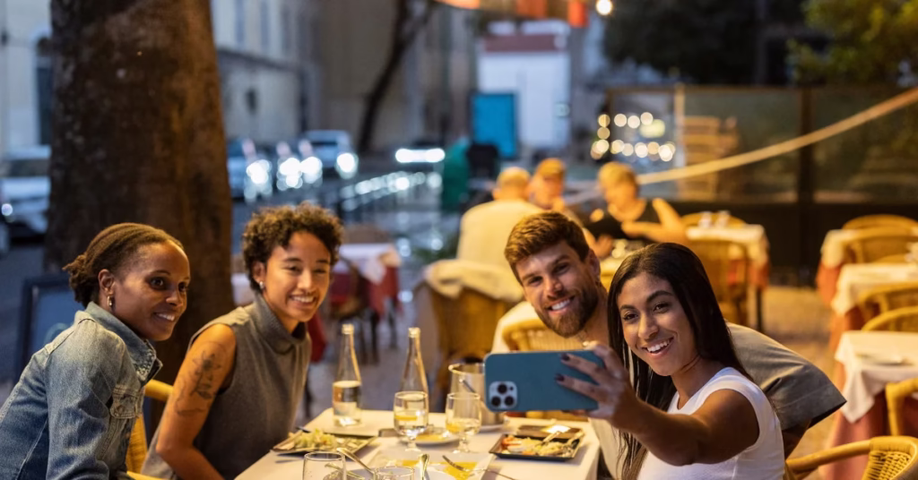Tourists enjoying local cuisine and city nightlife responsibly.