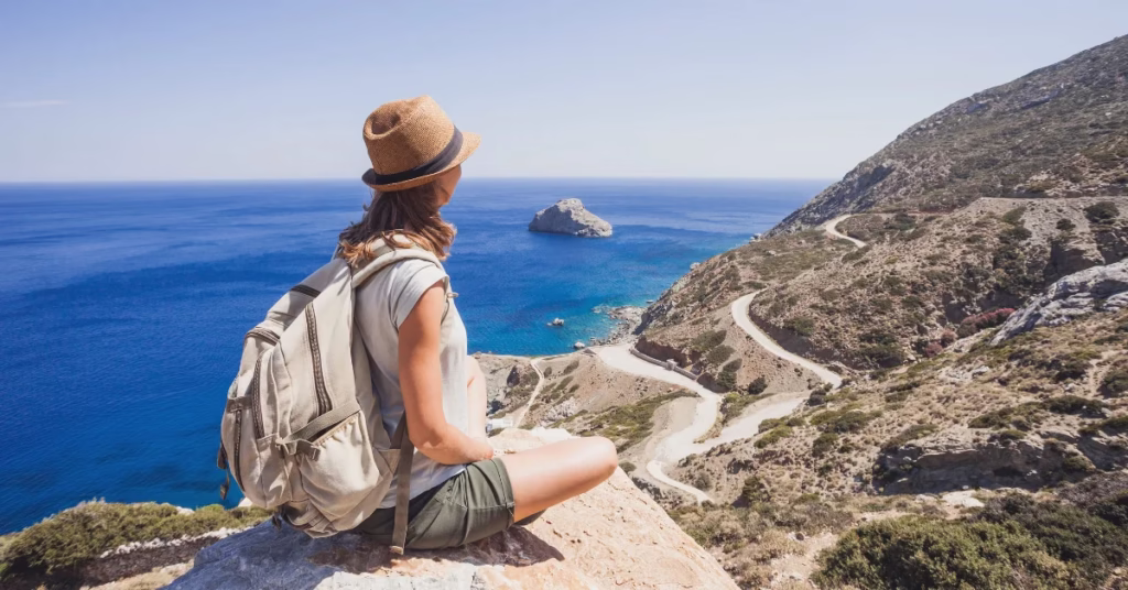 Traveler ensuring safety by using anti-theft backpack and offline map.