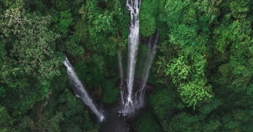 Sekumpul Waterfall in North Bali surrounded by rainforest