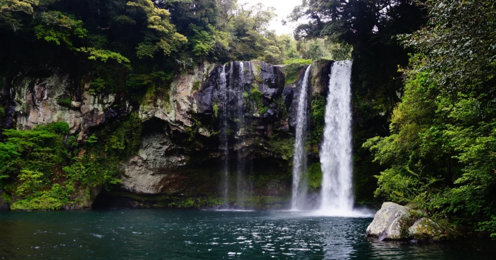Tegenungan Waterfall surrounded by jungle in Bali