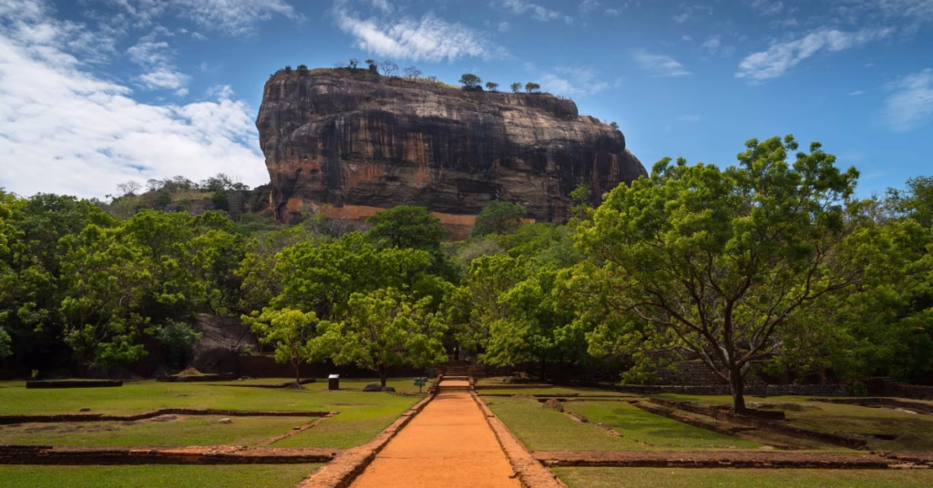 Hiker exploring Sigiriya Rock Fortress during Sri Lanka adventure travel.