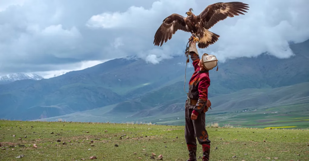 Kazakh eagle hunter in the Altai Mountains during Mongolia adventure travel.