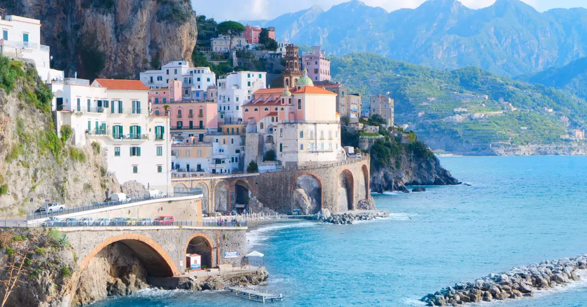 Aerial panorama of the Amalfi Coast with blue sea and pastel villages