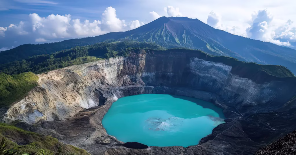 Sunrise view of Kelimutu volcano lakes with vibrant blue, green, and red colours