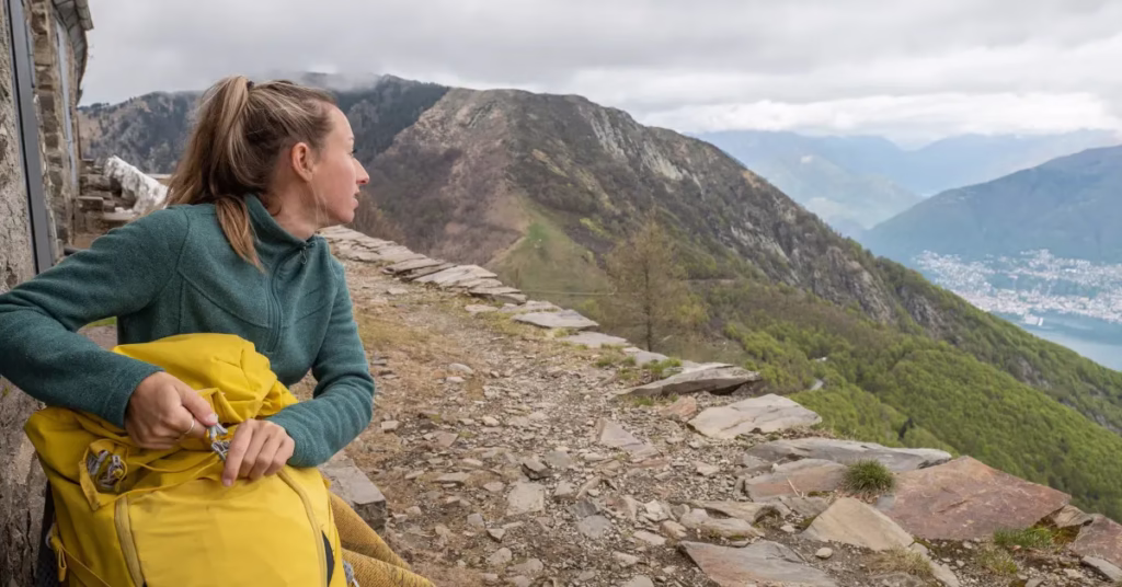 Hiker resting trail overlooking Lake Batur